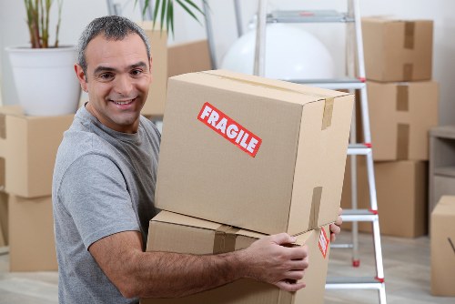 Student belongings including bags and a bicycle ready for storage